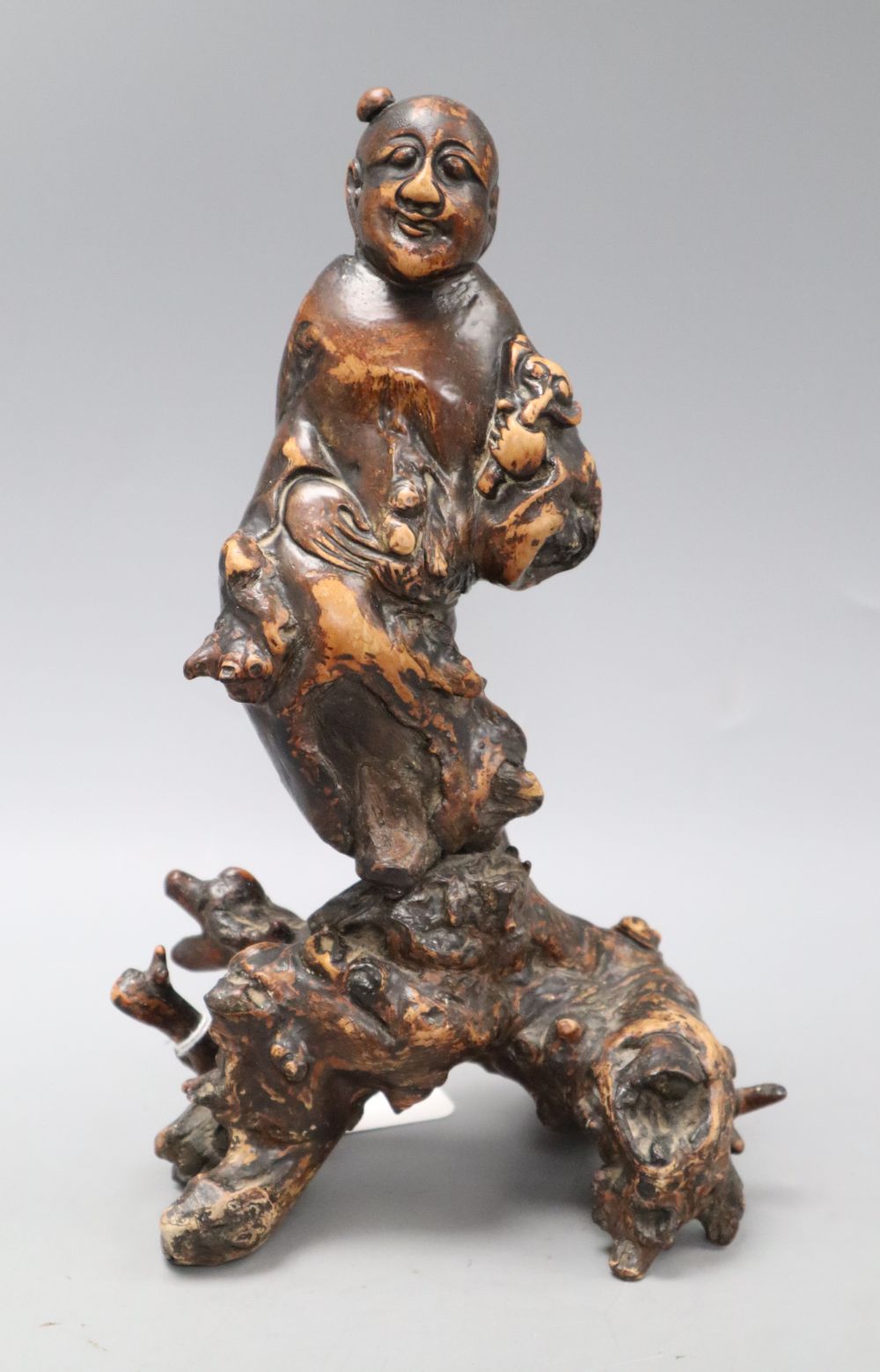 A Chinese rootwood carving of a deity, height 26cm